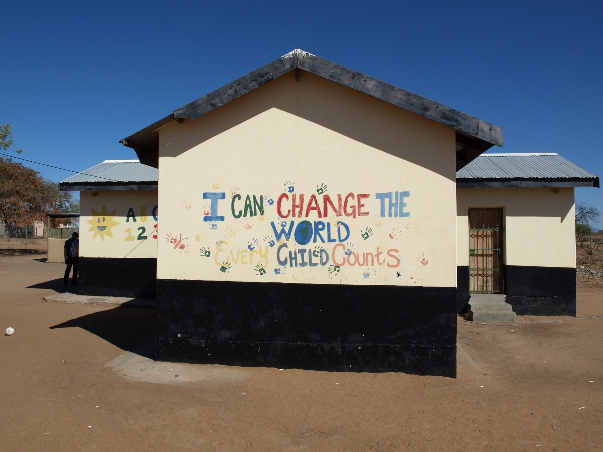 école bâtiment écriture "i can change the world"